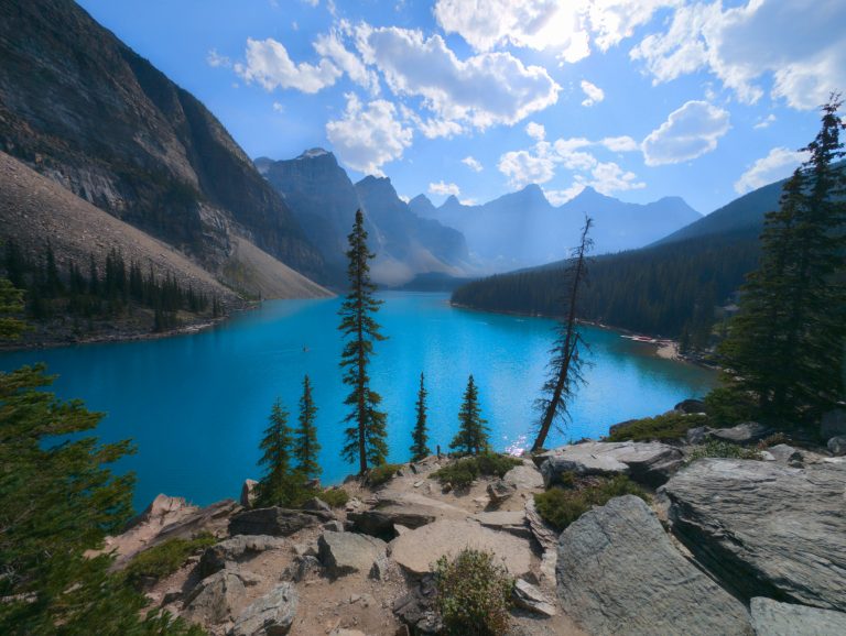 Breathtaking view of Moraine Lake with turquoise waters surrounded by mountains in Banff National Park, Canada.